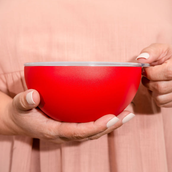 Serving Bowl with lid Filled with Icing Next to Charcuterie Board of Sweet Treats
